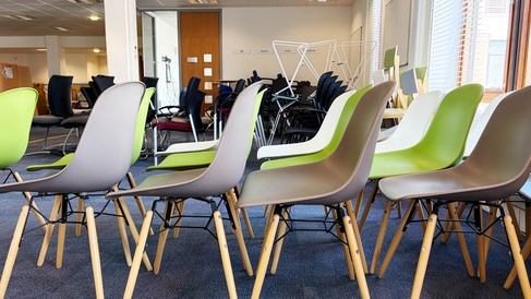 Coloured chairs in a row