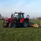 Tractor in a field pulling along a Trailing Shoe
