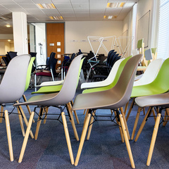 Coloured chairs in a row