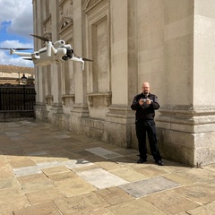AV Team staff flying a drone in Cambridge