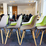Coloured chairs in a row